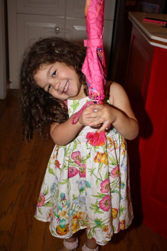 My parents gave Coraline a Dora the Explorer umbrella a while back, and it's one of her favorite fashion accessories. As it is, she only posed willingly for this photo since she was wearing one of her "princess" dresses. (Taken 4/27/14)